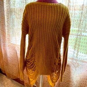 Active USA This stylish oversized sweater has the distressed/freyed look.